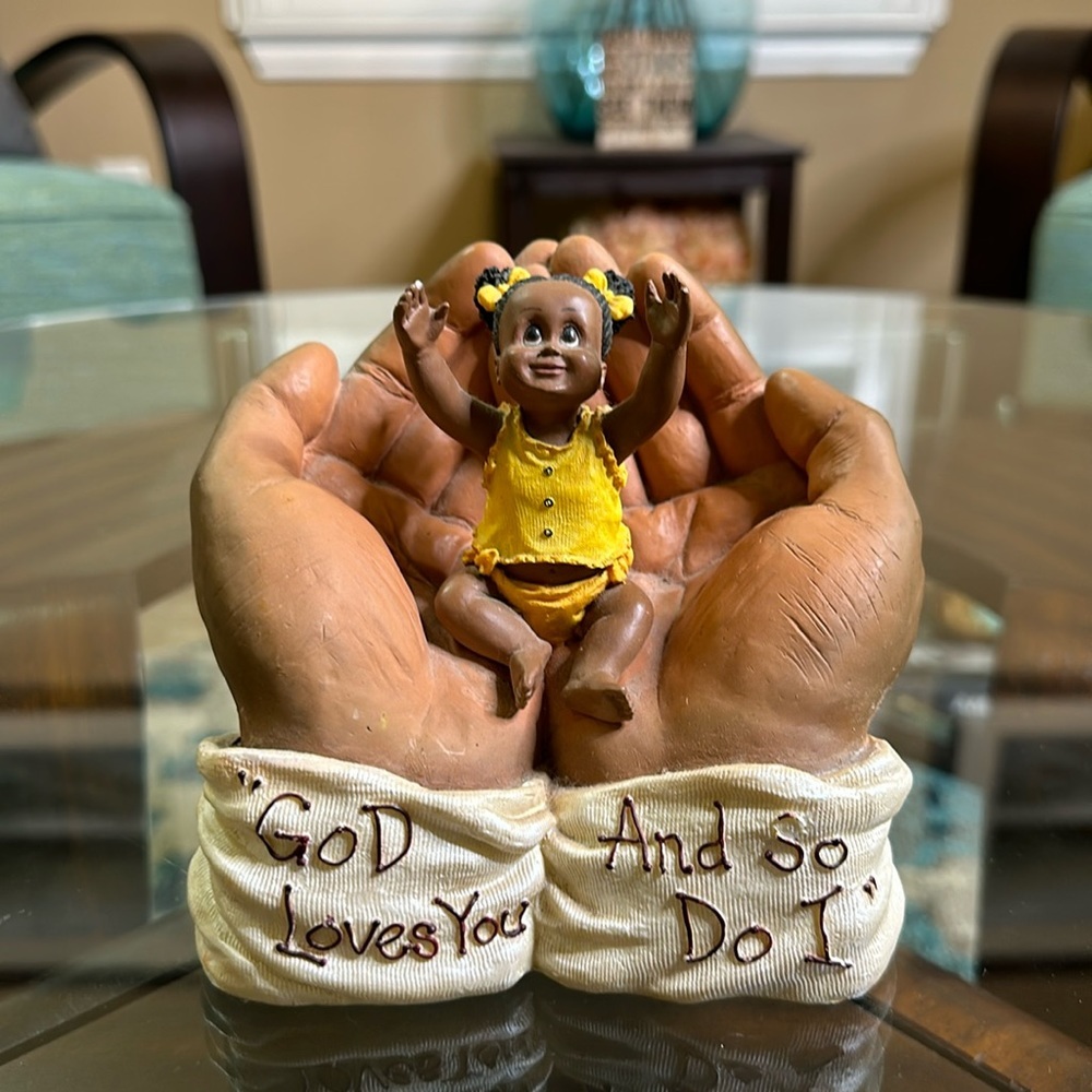 In his‎ hands figurine